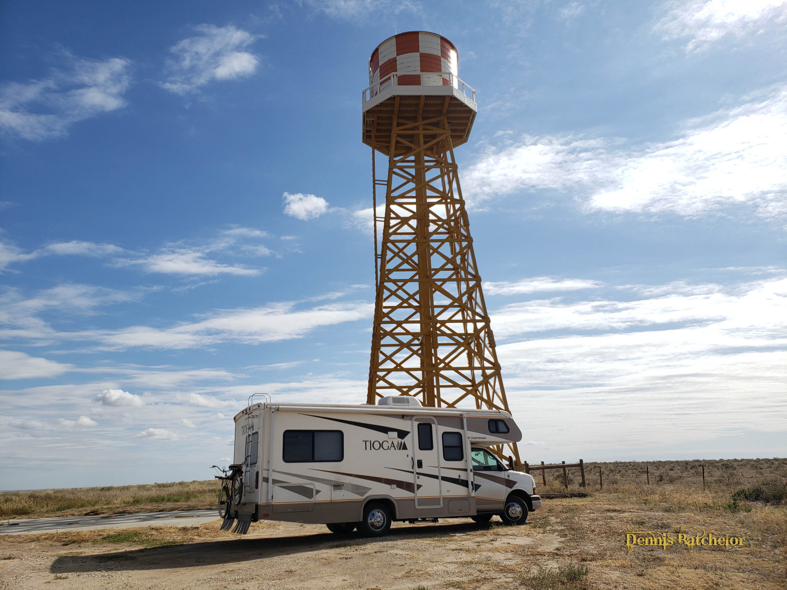 Ghost Gramps RV beneath a tall water tower